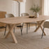 eettafel deens ovaal arc met drie stoelen en de tafel staat op een kleed