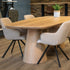 eettafel deens ovaal in de showroom met 4 mooie witte stoelen 