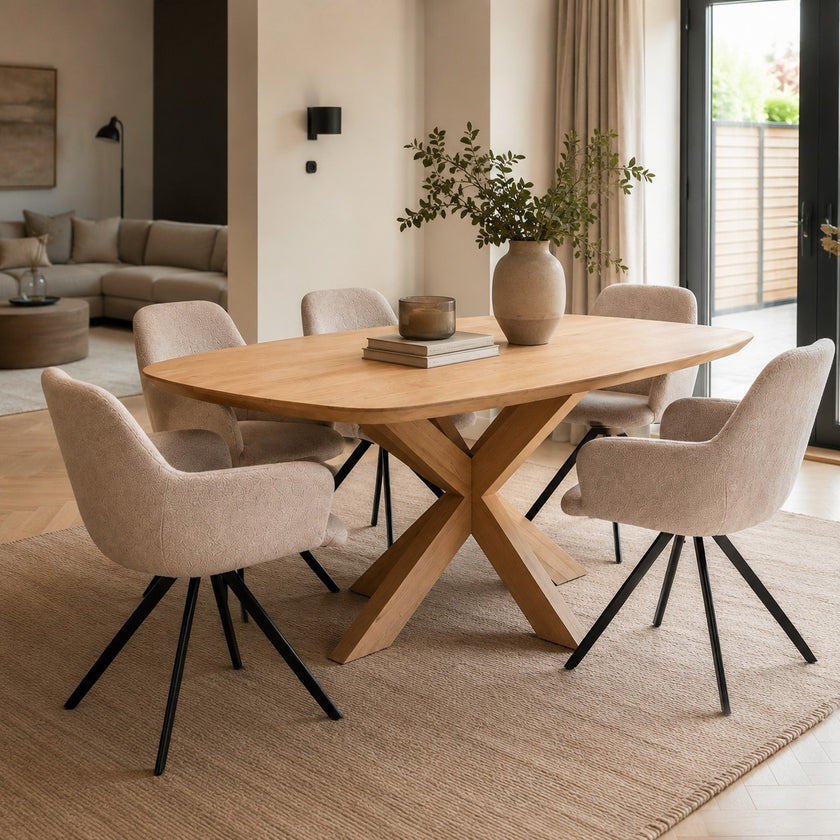 eettafel deens ovaal pillar in een moderne woonkamer met 5 stoelen op een kleed.