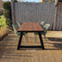 Industriële tuintafel met zwart stalen A-poot en Douglas houten blad in zonnige tuinsetting