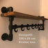Wandkapstok met zwarte steigerbuizen en vurenhouten legplank